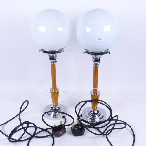 629 - WITHDRAWN: Pair of retro style chrome-mounted table lamps, with globular glass shades, 43cm