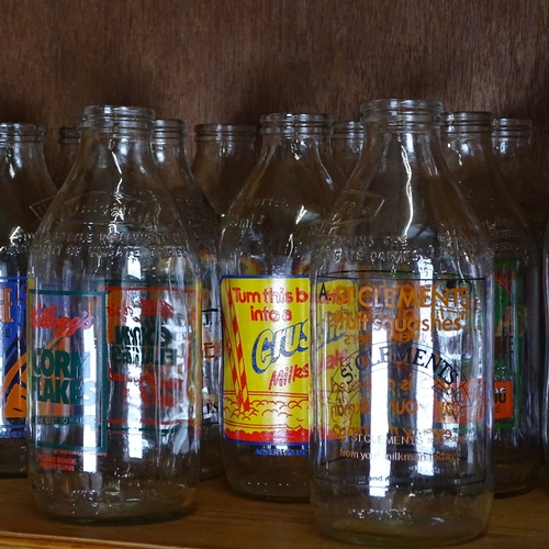 680 - A shelf of 1980s advertising milk bottles