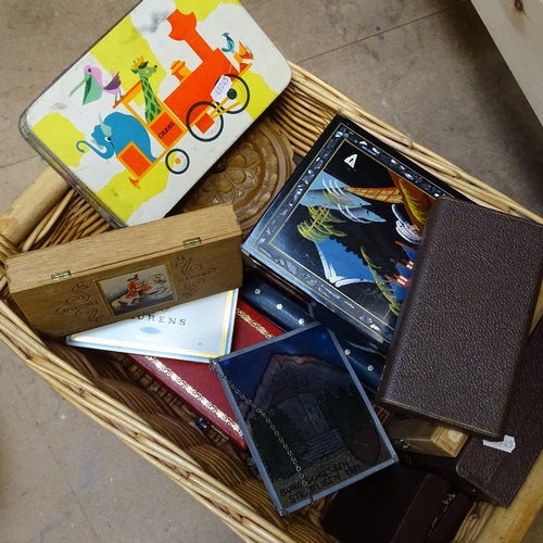 733 - A wicker basket with boxes, tins and musical boxes