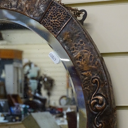 780 - A modern copper-framed circular bevel-edge wall mirror, overall diameter 55cm