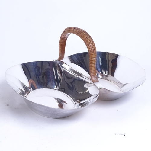 1029 - A silver plated toast rack, a 4-piece egg cup on stand with spoons, an embossed milk jug, and a 2-se... 