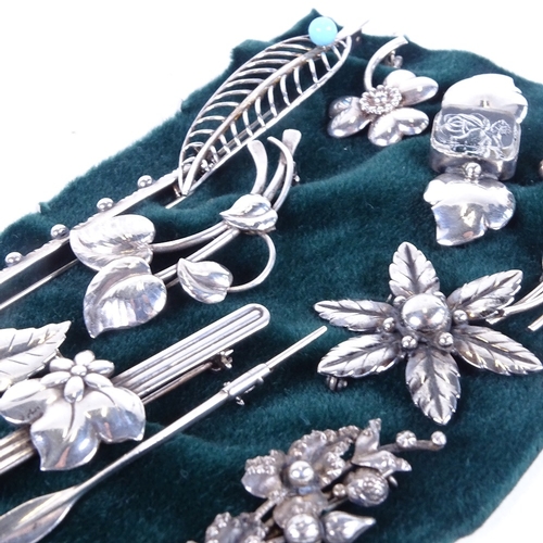 1081 - 11 various Danish silver brooches, to include pieces by Hermann Siersbol