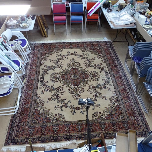 1986 - A large cream and red ground Tabriz design carpet, 360cm x 275cm