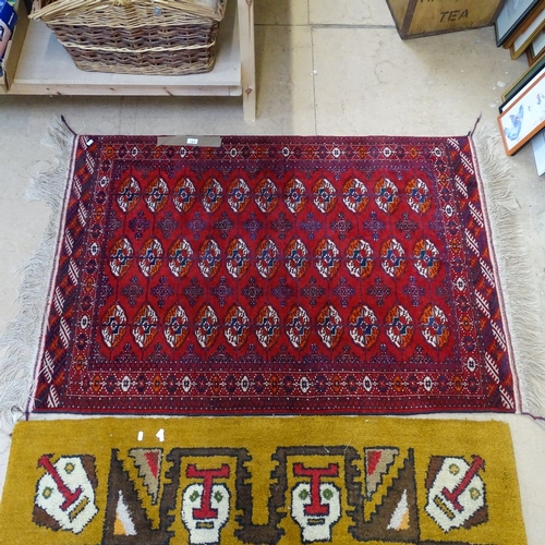 1988 - A red ground Tekke design rug, 150cm x 100cm