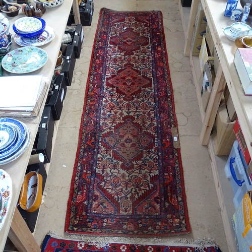 1990 - A red ground Persian design runner, 284cm x 80cm