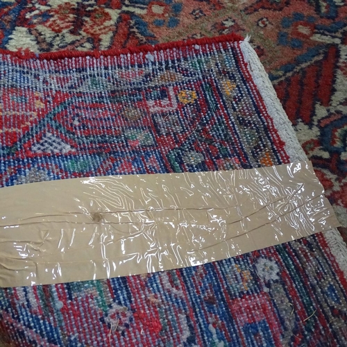 1990 - A red ground Persian design runner, 284cm x 80cm