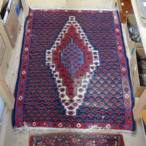 1991 - A Kilim red and blue ground floral pattern rug