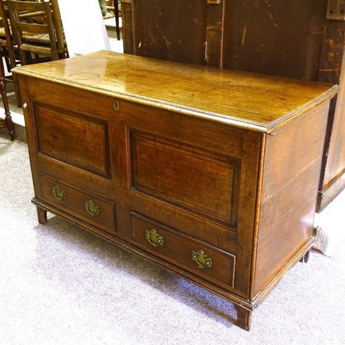 284 - An 18th century panelled oak mule chest, with 2 drawers under, width 115cm