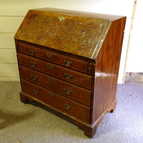 450 - A George III walnut bureau, stepped fitted interior with secret drawers and well, 4 long drawers bel... 