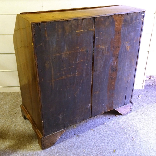 450 - A George III walnut bureau, stepped fitted interior with secret drawers and well, 4 long drawers bel... 