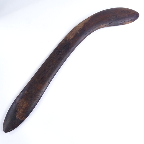 69 - A Tribal hardwood throwing spear/boomerang, with engraved stylised turtle design, probably 20th cent... 