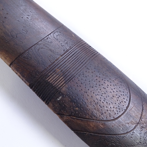 69 - A Tribal hardwood throwing spear/boomerang, with engraved stylised turtle design, probably 20th cent... 