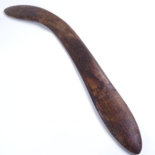 69 - A Tribal hardwood throwing spear/boomerang, with engraved stylised turtle design, probably 20th cent... 