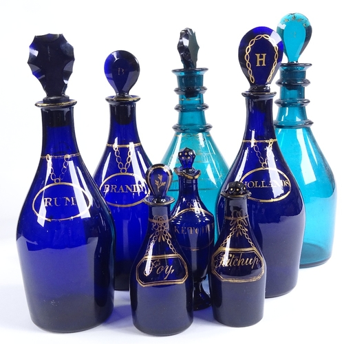 70 - A group of 8 various Bristol blue and green glass decanters and condiment bottles, with painted gild... 