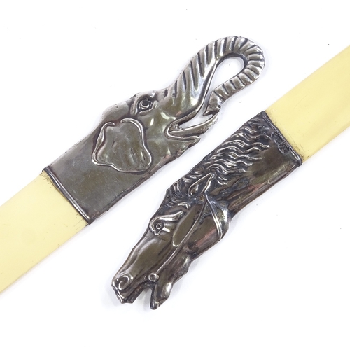 102 - A pair of Russian silver-handled paper knives, with horse and elephant head decorated handles, ivori... 