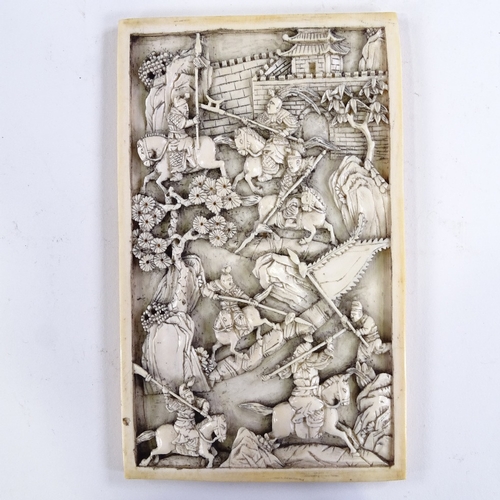 103 - An intricately carved Chinese relief ivory panel, 18th or early 19th century, depicting a dramatic b... 