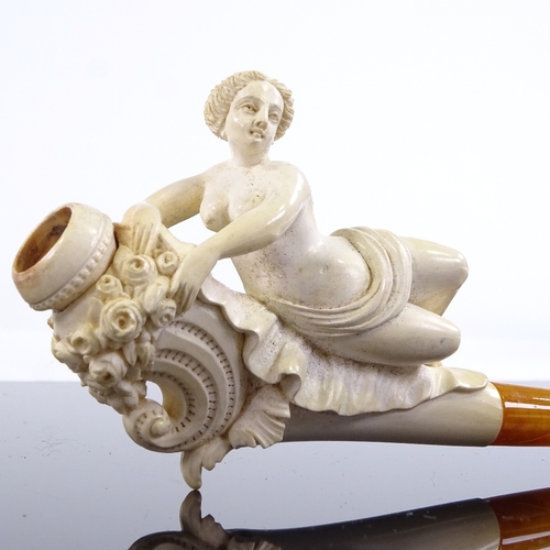 104 - A 19th century Meerschaum pipe surmounted by a nude reclining woman, length 13.5cm, original fitted ... 