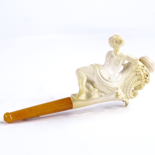 104 - A 19th century Meerschaum pipe surmounted by a nude reclining woman, length 13.5cm, original fitted ... 