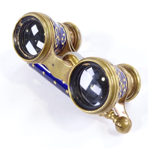 106 - A pair of 19th century French gilt-brass and blue enamel opera glasses, circa 1860, fold-out telesco... 