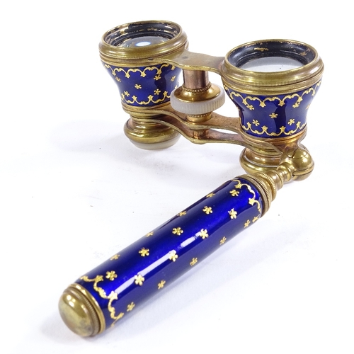 106 - A pair of 19th century French gilt-brass and blue enamel opera glasses, circa 1860, fold-out telesco... 