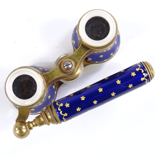 106 - A pair of 19th century French gilt-brass and blue enamel opera glasses, circa 1860, fold-out telesco... 