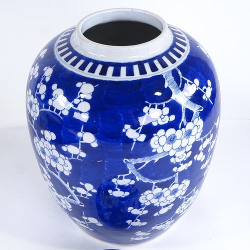 114 - A large Chinese blue and white porcelain jar and cover, with prunus decoration, height 34cm