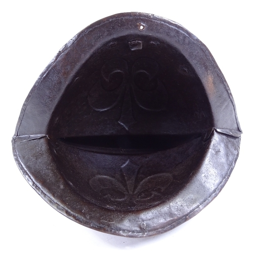 119 - A German steel Morion helmet, early 17th century, with relief moulded fleur de lis emblem, length 36... 