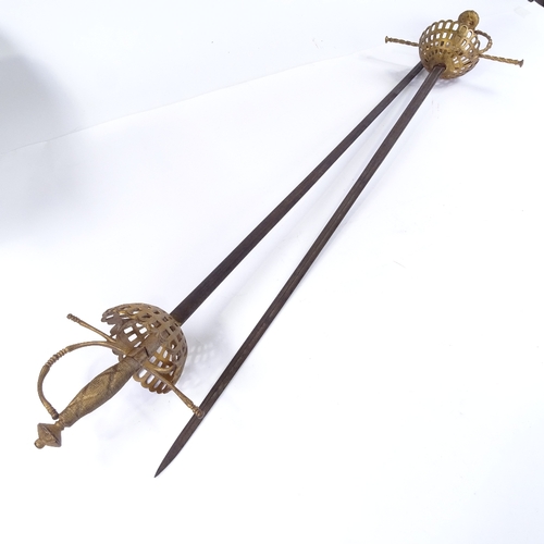 121 - A pair of ornamental swords with basket hilts