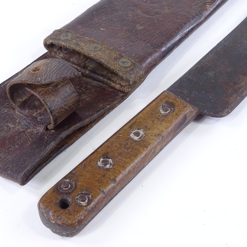 124 - A Second World War Period machete by Kitchin Ltd of Sheffield, dated 1943, leather scabbard, blade l... 