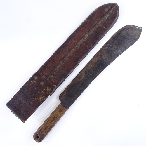 124 - A Second World War Period machete by Kitchin Ltd of Sheffield, dated 1943, leather scabbard, blade l... 