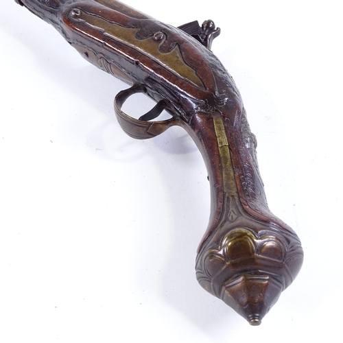 126 - An 18th century Continental flintlock pistol with brass mounts, overall length 46cm