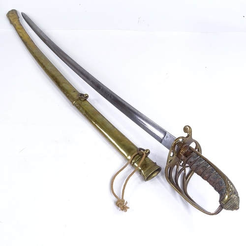 129 - A Victorian Navy Officer's dress sword with brass hilt, etched blade and brass scabbard