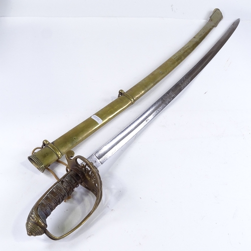 129 - A Victorian Navy Officer's dress sword with brass hilt, etched blade and brass scabbard