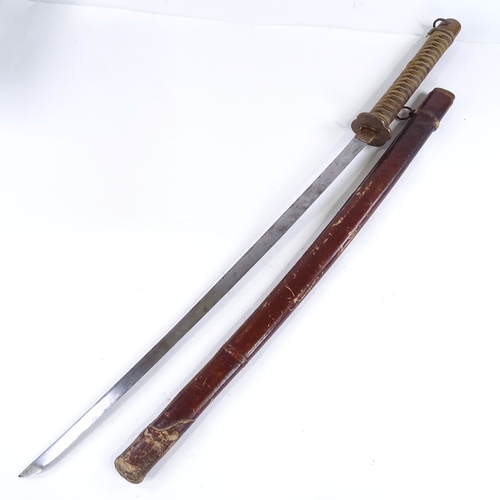 132 - A Japanese sword, early to mid-20th century, with leather scabbard, blade length 68.5cm