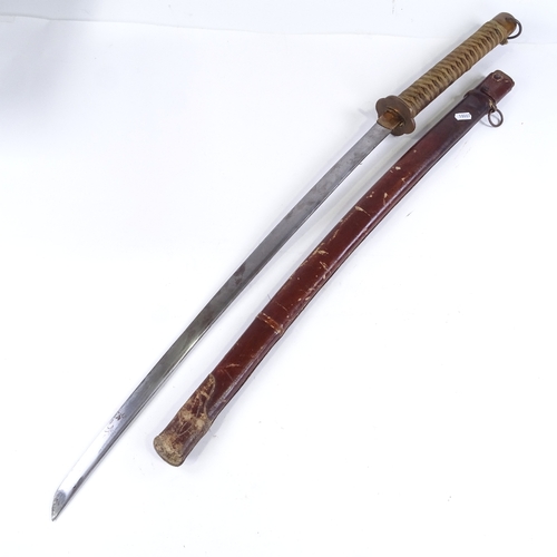 132 - A Japanese sword, early to mid-20th century, with leather scabbard, blade length 68.5cm