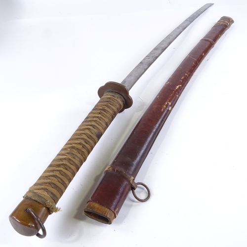 132 - A Japanese sword, early to mid-20th century, with leather scabbard, blade length 68.5cm