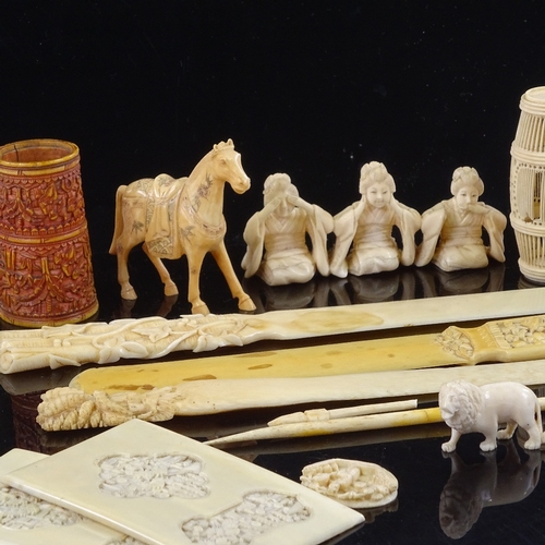 161 - A group of Chinese ivory paper knives, Japanese ivory figures, and other carvings