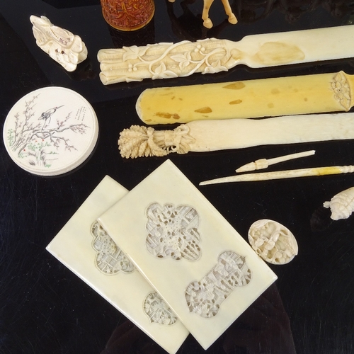 161 - A group of Chinese ivory paper knives, Japanese ivory figures, and other carvings