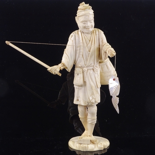 164 - A Japanese ivory okimono depicting a fisherman with a mother-of-pearl fish, Meiji Period, height 25c... 