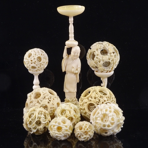 166 - A collection of 19th century Chinese ivory puzzle balls, some on stands