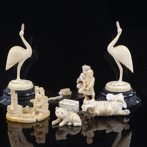 169 - A group of Indian and Chinese ivory carvings, including a snake charmer