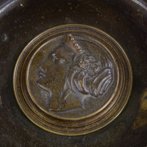 83 - A 19th century patinated bronze tazza, with central relief cast medallion, rim diameter 20cm, height... 