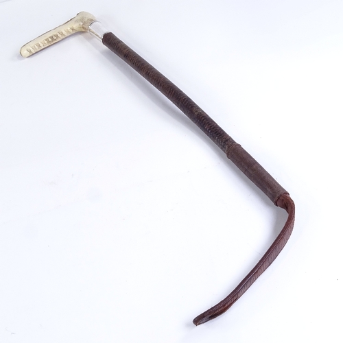 85 - A Victorian horn-handled woven leather riding crop