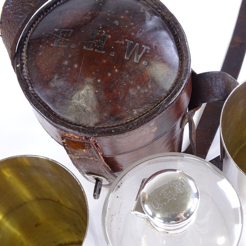 86 - A 19th century leather-cased picnic drinks set, comprising a tapered glass flask and pair of plated ... 