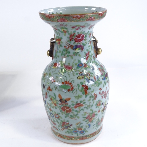 92 - A 19th century Chinese celadon glaze porcelain vase, with painted enamel birds flowers and butterfli... 