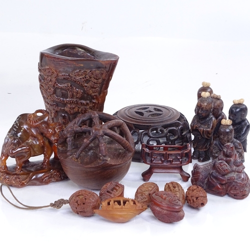 178 - A group of Oriental miniature carved wood figures, carved nut boats, horn buffalo etc