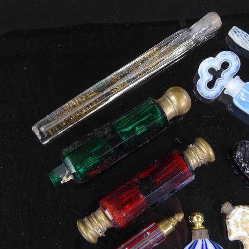 184 - A group of mainly 19th century glass scent bottles, including ruby and green double-ended, and an op... 