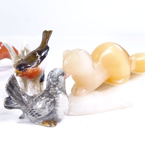 187 - A group of miniature porcelain and hardstone animals, including a carved cat's eye stoat, length 8cm