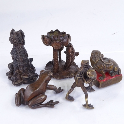 215 - A group of miniature Japanese bronzes, including a seated Dog of Fo, height 5.5cm, a carp under a li... 