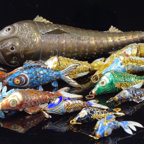 220 - A collection of brass and enamel articulated fish, largest length 22cm